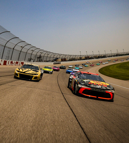 BROOKLYN, MICHIGAN - JUNE 08: Chase Briscoe, driver of the #19 Bass Pro Shops Toyota, and Kyle Busch, driver of the #8 BetMGM Chevrolet, lead the field on a pace lap prior to the NASCAR Cup Series FireKeepers Casino 400 at Michigan International Speedway on June 08, 2025 in Brooklyn, Michigan. (Photo by Meg Oliphant/Getty Images)