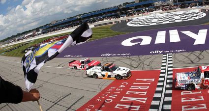 Corey Heim, driver of the #1 Celsius Toyota, takes the checkered flag ahead of Kaden Honeycutt, driver of the #11 Safelite Toyota, to win the NASCAR Craftsman Truck Series DQS Solutions & Staffing 250 presented by Precision Vehicle Logistics at Michigan International Speedway on June 06, 2026 in Brooklyn, Michigan. (Photo by Brett Farmer/Getty Images)
