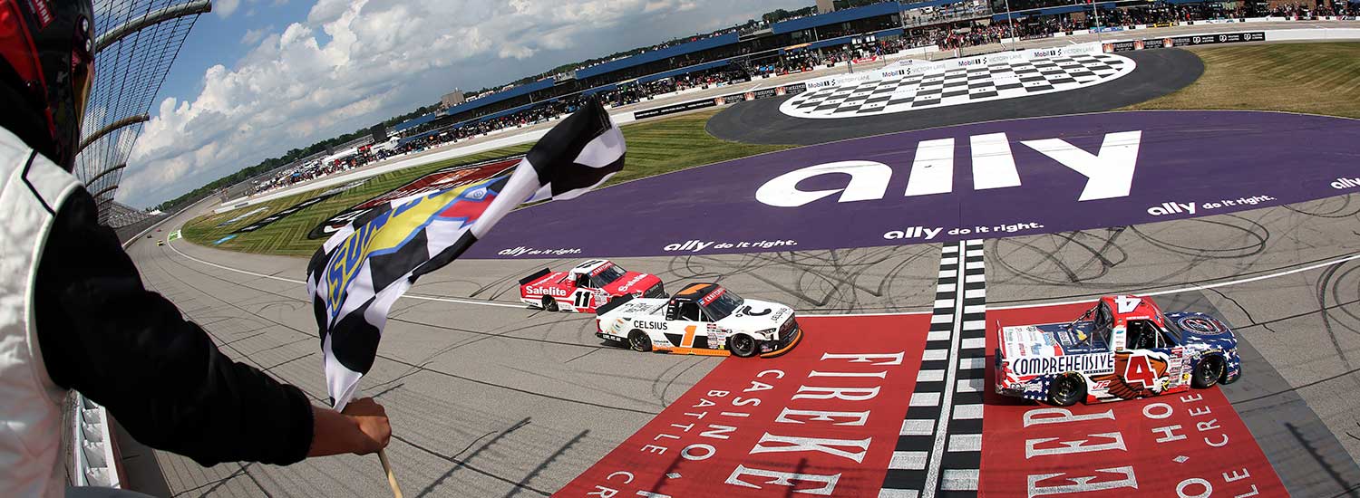 Corey Heim, driver of the #1 Celsius Toyota, takes the checkered flag ahead of Kaden Honeycutt, driver of the #11 Safelite Toyota, to win the NASCAR Craftsman Truck Series DQS Solutions & Staffing 250 presented by Precision Vehicle Logistics at Michigan International Speedway on June 06, 2026 in Brooklyn, Michigan. (Photo by Brett Farmer/Getty Images)