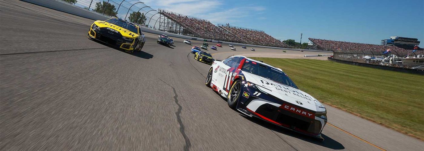 JUNE 07: Denny Hamlin, driver of the #11 National Debt Relief Toyota, and Carson Hocevar, driver of the #77 Zeigler Auto Group Chevrolet, lead the field on a pace lap prior to the NASCAR Cup Series FireKeepers Casino 400 at Michigan International Speedway on June 07, 2026 in Brooklyn, Michigan. (Photo by Sean Gardner/Getty Images