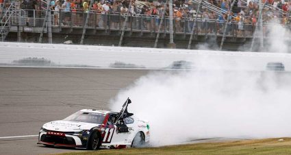 Denny Hamlin, driver of the #11 National Debt Relief Toyota, celebrates with a burnout after winning the NASCAR Cup Series FireKeepers Casino 400 at Michigan International Speedway on June 07, 2026 in Brooklyn, Michigan. (Photo by Sean Gardner/Getty Images)